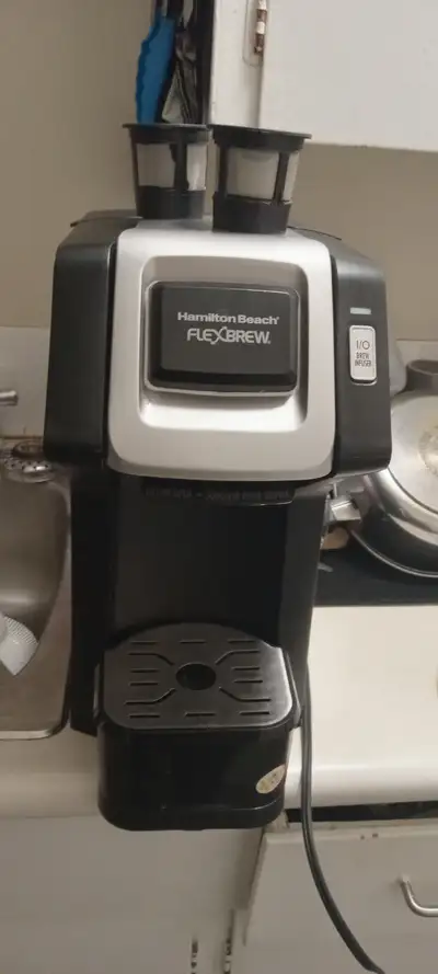 For sale black hamilton beach flex brew comes with 3 refillable coffee pods and a box of tim hortons...