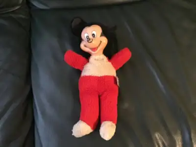 This stuffed Mickey is tagged Mickey Moyse, Walt Disney Productions In good condition