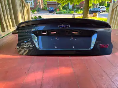 Selling an original factory (OEM) trunk lid removed from a Subaru WRX STI while new. The paint code...