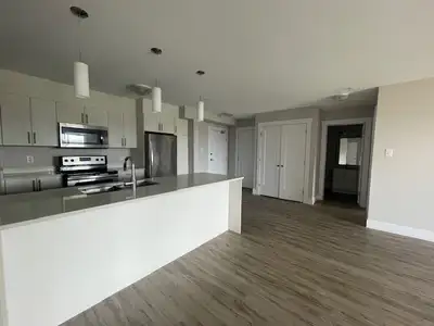 Spacious first floor unit featuring two bedrooms, including a master bedroom with a large walk-in cl...