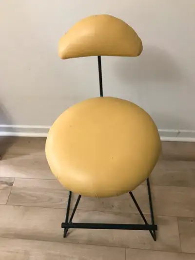Hand made funky bar stool. Wrought iron frame with yellow leather seat and back. Sturdy with foot re...