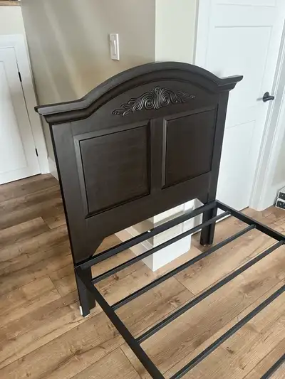 Beautiful solid wood headboard and twin metal frame very strong made in Canada call 4169992294 to pi...