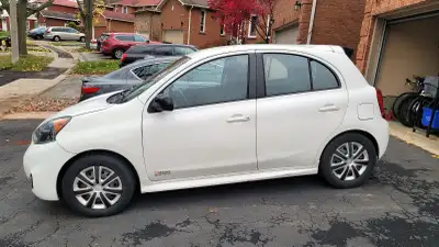 2015 Nissan Micra SR manual transmission. Super reliable fun little car.