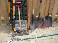 Garden tools and rack -tree pruner, rake, fork, shovels, hatchet