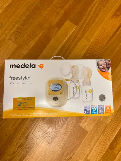 Medela Freestyle double breast pump, used twice, clean pet free smoke free home. Basically new. Incl...
