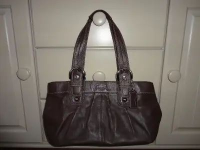 Coach pleated leather tote purse, brown, top zipper closure, lots of compartments, new condition, $7...
