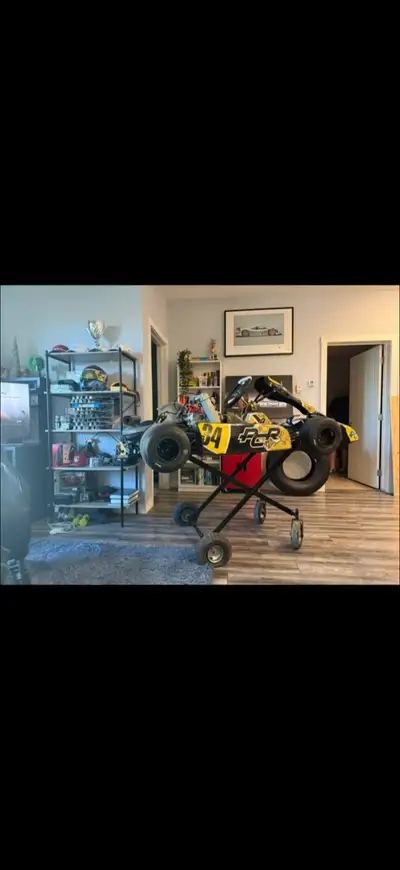 Selling a used go-kart, perfect for racing enthusiasts! It has a yellow and black design with the nu...