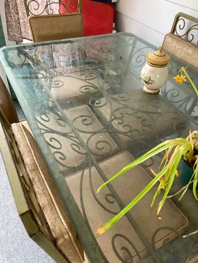Custom vintage wrought iron table with glass top and six chairs. Can used for dining room table or p...