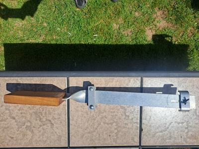 Motor mount for a canoe. Looks like max width it will clamp is 13-14 inches.