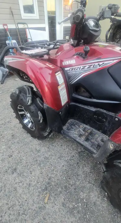 Get ready to tackle any terrain with this rugged Yamaha Grizzly ATV! While it's not brand new, it's...