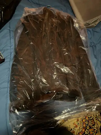 This is high quality it’s large but fits more like a medium new condition selling cause a little tig...