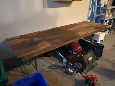 This is an 8 ft long folding table, perfect for events or as a temporary workstation; note it is use...