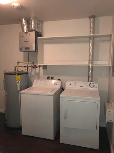 Open concept spacious living room/kitchen,kitchen with lots of cupboards . Bath room with shower tub...