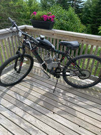 Two mountain bikes with 80cc engines both work but  need a littl