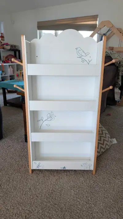 Kids wall mountable bookshelf. Adds extra space for children to put everything onto which isn't usua...