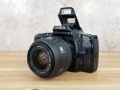 Minolta Maxxum 3xi SLR 35mm Film Camera with 35-70mm AF Lens, View more