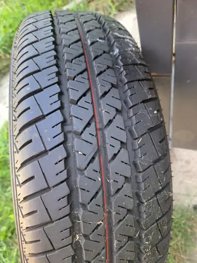 New tire 175/65/14 Firestone $30 OBO Steve 519 590 8162