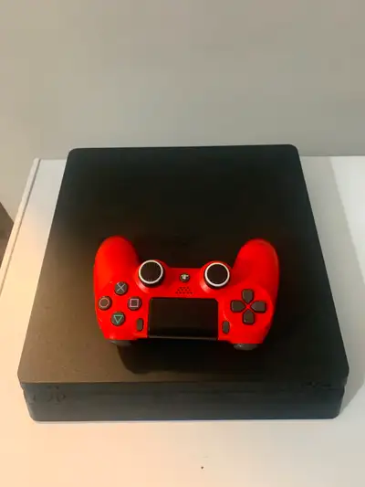PS4 slim used for sale with a red controller and a wired hyper x headset. All necessary cables inclu...