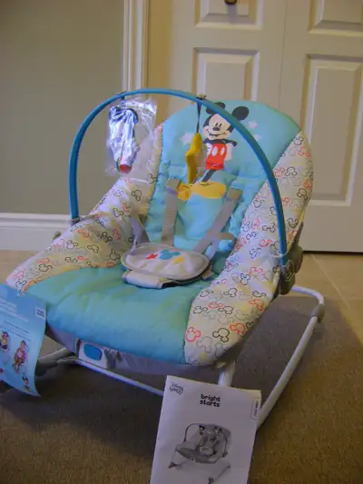 Bright Starts Brand new with tags A baby rocker to a toddler seat (up to 40 lbs) Soothing vibration...