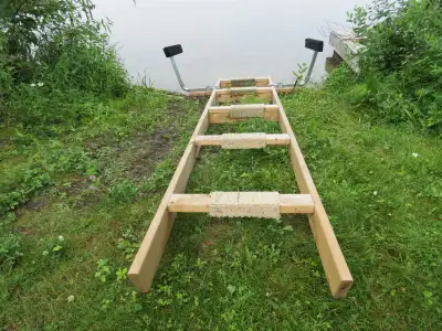 Boat or Kayak Ramp. Constructed of 2"x6" pressure treated lumber. Complete with guides. Asking $225