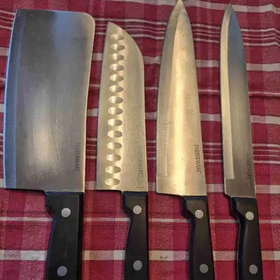 4 piece chef carving set. Excellent condition, stainless steel 'Farberware' Nice heavy handles.