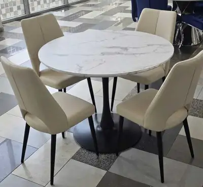 Upgrade your dining space with this stylish round dining table set, perfect for modern homes! This t...