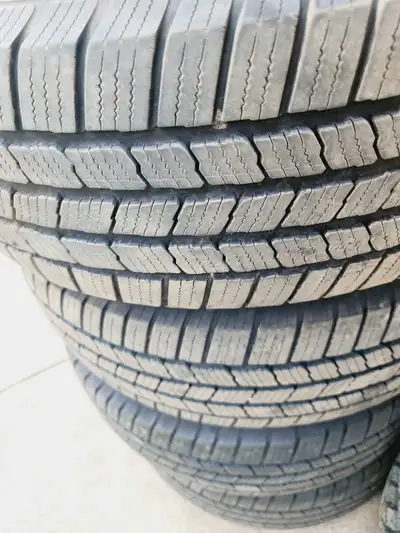 For sale is a set of four 255/65 R17 Michelin Defender tires mounted on aluminum rims, perfect for p...