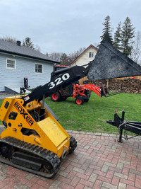 Landscaping or construction equipment