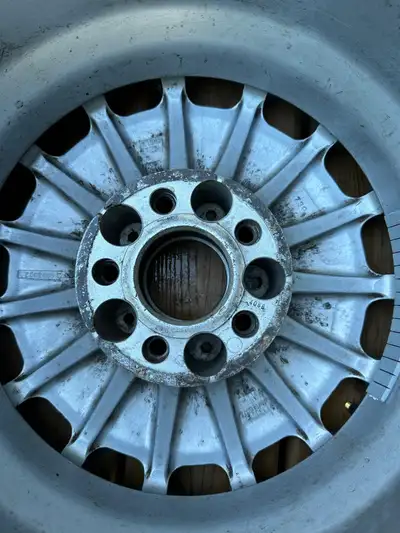 A set of four used Mercedes rims, fitted with new valves and repainted. They feature a distinct, mul...