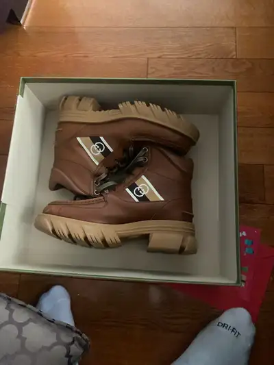 Size 7 women Gucci  boots  comes with original packaging , View more