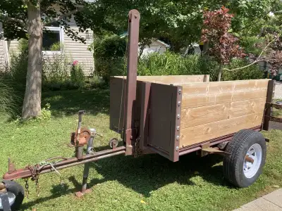 Heavy Duty Dumping Utility Trailer. Solid axle, new hubs, 14” trailer wheels. Can be filled with top...
