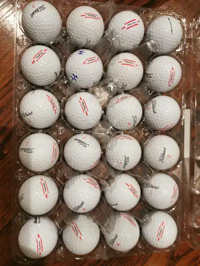 Two dozens of golf balls, View more