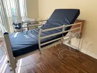 Invacare etude hospital bed with full rails and medical mattress