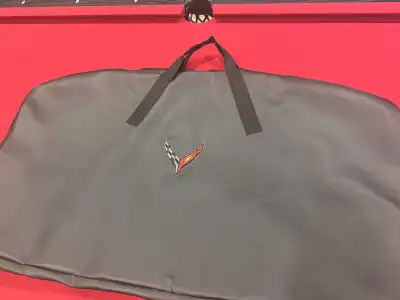 Brand new corvette roof panel storage bag has rear ports for trunk storage clips