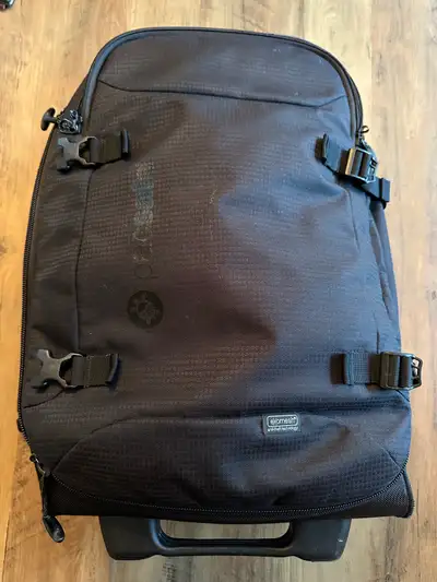 This is a PacSafe TourSafe 40L carry-on roller bag, perfect for travel with its anti-theft features...
