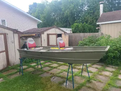 Lunch 1232 with 2.5 hp suzuki. Comes with 2 removable swivel seats and cleats. Anchor and paddles. R...