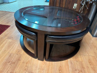 Coffee table & 4 stools. No nicks or tears. In perfect shape. 