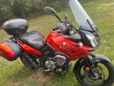 I'm selling a used 2010 Suzuki V-Strom with 33902 km, complete with a top case and side panniers, pe...
