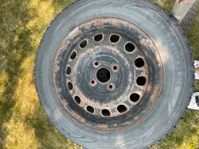 I'm selling a set of four used Hankook Winter i*Pike tires, size 175/70R14 84T, mounted on steel rim...
