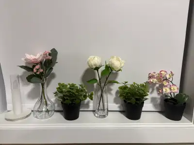 A vase with 2 artificial flowers, View more