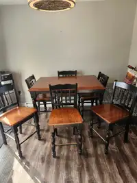 Bar high , table with 6 chairs. Table opens up.