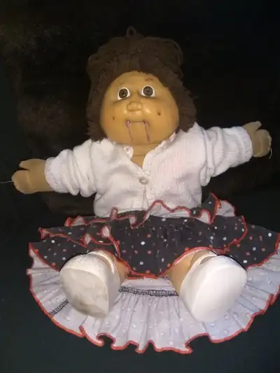 cabbage patch dolls with original outfits and extra outfits. one brunette, one blonde = $45.00 each...