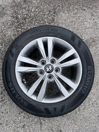 16 inch Hyundai Elantra original alloy 4 wheels with tires. Tire