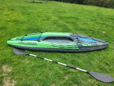 Inflatable kayak with paddle for sale. No pump included but can be pumped up prior to arrival to sho...