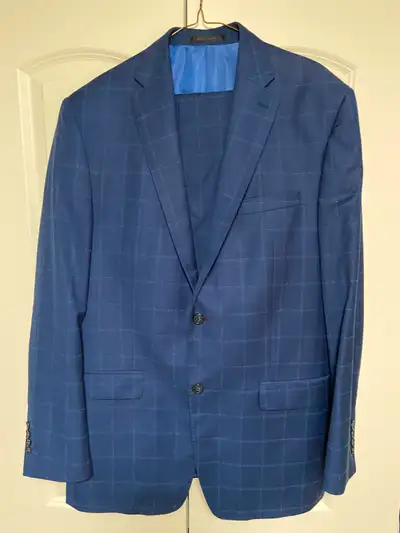 Men’s Blue Suit from Tip Top Taylor. Has a blue pinstripe. Brand Name – Grafton. Made in Canada. Pan...