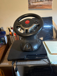 PS3 bundle with Intec steering wheel and games