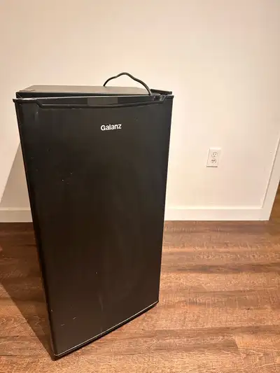 Clean and well-maintained Galanz mini refrigerator, perfect for an apartment, basement unit, office,...
