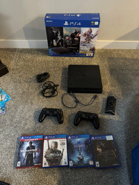 1tb PlayStation 4 with 2 controllers and 4 games 