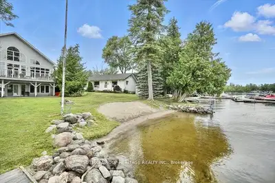 Home business opportunity situated in cottage country. This stunning lakefront home is located on St...
