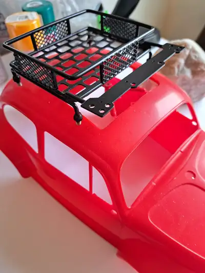 Enhance your RC vehicle with this compact and versatile 4-inch x 4-inch roof rack, designed specific...